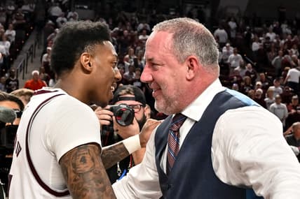 Mar 4, 2023; College Station, Texas, USA;  Texas A&M Aggies head coach Buzz Williams and guard Wade Taylor IV (4) embrace after defeating the Alabama Crimson Tide at Reed Arena. Mandatory Credit: Maria Lysaker-USA TODAY Sports