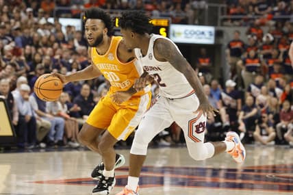 Mar 4, 2023; Auburn, Alabama, USA;  Tennessee Volunteers guard Josiah-Jordan James (30) drives in against Auburn Tigers guard Zep Jagainstper (12) during the first half at Neville Arena. Mandatory Credit: John Reed-USA TODAY Sports