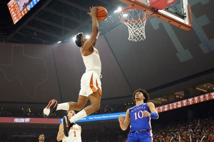 Mar 4, 2023; Austin, Texas, USA; Texas Longhorns guard Tyrese Hunter (4) dunks over Kansas Jayhawks forward Jalen Wilson (10) during the first half at Moody Center. Mandatory Credit: Scott Wachter-USA TODAY Sports