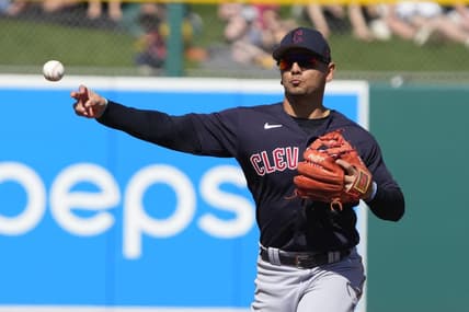 Mar 4, 2023; Mesa, Arizona, USA; Cleveland Guardians second baseman Andres Gimenez (0) makes the play for an out against the Oakland Athletics in the first inning at Hohokam Stadium. Mandatory Credit: Rick Scuteri-USA TODAY Sports