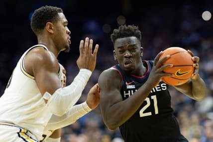 Mar 4, 2023; Philadelphia, Pennsylvania, USA; Connecticut Huskies forward Adama Sanogo (21) drives against Villanova Wildcats forward Eric Dixon (43) during the first half at Wells Fargo Center. Mandatory Credit: Bill Streicher-USA TODAY Sports