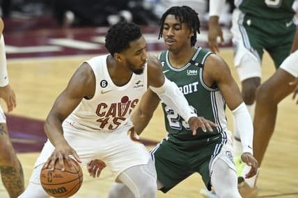 Mar 4, 2023; Cleveland, Ohio, USA; Cleveland Cavaliers guard Donovan Mitchell (45) dribbles beside Detroit Pistons guard Jaden Ivey (23) in the second quarter at Rocket Mortgage FieldHouse. Mandatory Credit: David Richard-USA TODAY Sports