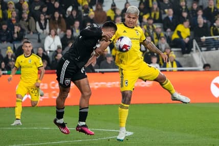 Mar 4, 2023; Columbus, Ohio, USA;  Columbus Crew forward Cucho Hernandez (9) fights for a ball with D.C. United midfielder Andy Najar (14) during the first half of the MLS soccer match at Lower.com Field. Mandatory Credit: Adam Cairns-The Columbus Dispatch

Mls Ceb Crew Dc