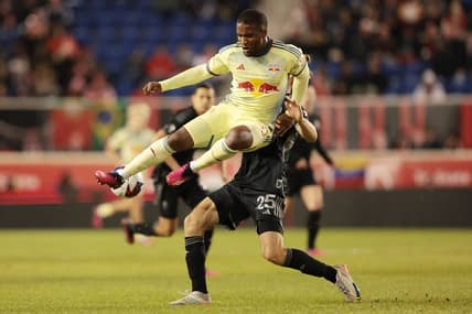 Mar 4, 2023; Harrison, New Jersey, USA; New York Red Bulls forward Elias Manoel (11) and Nashville SC defender Walker Zimmerman (25) battle for the ball during the second half at Red Bull Arena. Mandatory Credit: Vincent Carchietta-USA TODAY Sports
