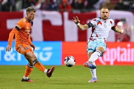 Mar 4, 2023; Chicago, Illinois, USA;  Chicago Fire FC defender Rafael Czichos (5) kicks the ball past New York City FC midfielder Matias Pellegrini (17) in the first half at Soldier Field. Mandatory Credit: Jamie Sabau-USA TODAY Sports