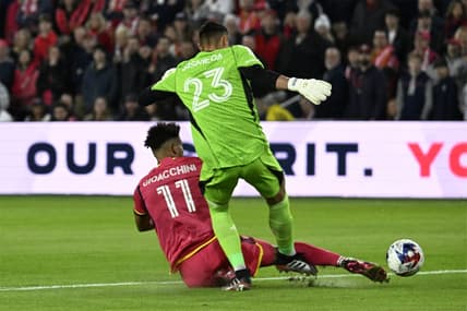Mar 4, 2023; St. Louis, Missouri, USA; St. Louis City forward Nicholas Gioacchini (11) tackles the ball away from Charlotte FC goalkeeper Pablo Sisniega (23) in the first half at CITYPARK. Mandatory Credit: Scott Rovak-USA TODAY Sports