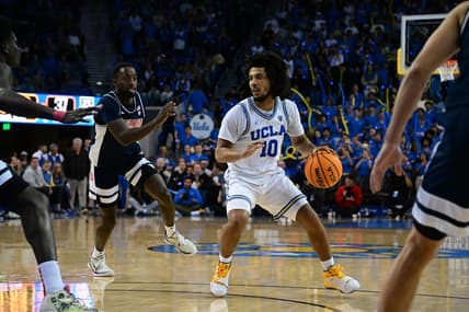 Mar 4, 2023; Los Angeles, California, USA;  UCLA Bruins guard Tyger Campbell (10) controls the ball as Arizona Wildcats guard Courtney Ramey (0) defends during the second half at Pauley Pavilion presented by Wescom. Mandatory Credit: Richard Mackson-USA TODAY Sports
