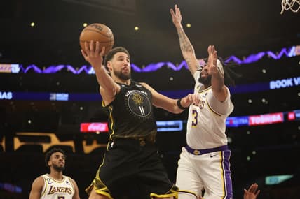 Mar 5, 2023; Los Angeles, California, USA; Golden State Warriors guard Klay Thompson (11) goes to the basket against Los Angeles Lakers forward Anthony Davis (3) during the first quarter at Crypto.com Arena. Mandatory Credit: Kiyoshi Mio-USA TODAY Sports