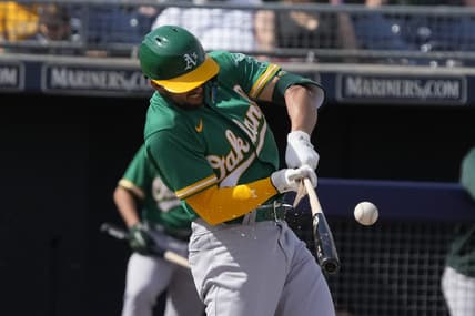 Mar 5, 2023; Peoria, Arizona, USA; Oakland Athletics third baseman Kevin Smith (4) breaks his bat against the San Diego Padres in the third inning at Peoria Sports Complex. Mandatory Credit: Rick Scuteri-USA TODAY Sports