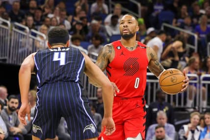 Mar 5, 2023; Orlando, Florida, USA; Portland Trail Blazers guard Damian Lillard (0) brings the ball up court in front of Orlando Magic guard Jalen Suggs (4) during the first quarter at Amway Center. Mandatory Credit: Mike Watters-USA TODAY Sports