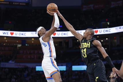 Mar 5, 2023; Oklahoma City, Oklahoma, USA; Oklahoma City Thunder guard Shai Gilgeous-Alexander (2) shoots as Utah Jazz guard Kris Dunn (11) defends the shot during the second quarter at Paycom Center. Mandatory Credit: Alonzo Adams-USA TODAY Sports