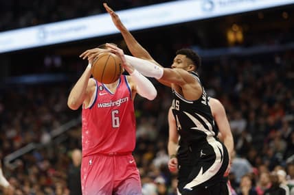 Mar 5, 2023; Washington, District of Columbia, USA; Milwaukee Bucks forward Giannis Antetokounmpo (34) knocks the ball from Washington Wizards center Kristaps Porzingis (6) in the second quarter at Capital One Arena. Mandatory Credit: Geoff Burke-USA TODAY Sports