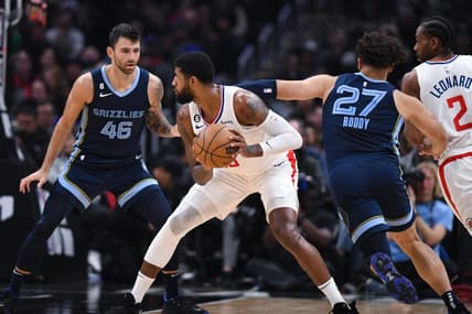 Mar 5, 2023; Los Angeles, California, USA; LA Clippers forward Paul George (13) looks to pass the ball against Memphis Grizzlies guard John Konchar (46) and forward David Roddy (27) during second quarter at Crypto.com Arena. Mandatory Credit: Jonathan Hui-USA TODAY Sports