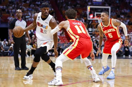 Mar 6, 2023; Miami, Florida, USA; Miami Heat forward Jimmy Butler (22) dribbles the basketball as Atlanta Hawks guard Trae Young (11) defends during the first quarter at Miami-Dade Arena. Mandatory Credit: Sam Navarro-USA TODAY Sports