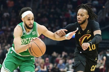 Mar 6, 2023; Cleveland, Ohio, USA; Boston Celtics guard Derrick White (9) drives to the basket against Cleveland Cavaliers guard Darius Garland (10) during the first half at Rocket Mortgage FieldHouse. Mandatory Credit: Ken Blaze-USA TODAY Sports