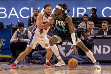 Mar 6, 2023; Detroit, Michigan, USA; Detroit Pistons guard Cory Joseph (18) defends against Portland Trail Blazers forward Jerami Grant (9) during the first quarter at Little Caesars Arena. Mandatory Credit: David Reginek-USA TODAY Sports