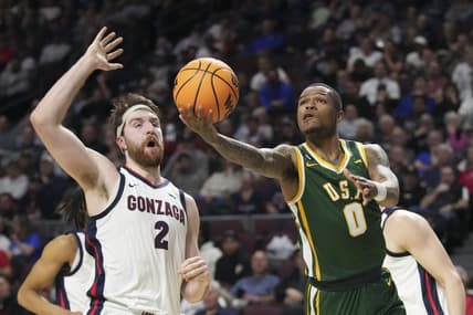 March 6, 2023; Las Vegas, NV, USA; San Francisco Dons guard Khalil Shabazz (0) shoots the basketball against Gonzaga Bulldogs forward Drew Timme (2) during the first half in the semifinals of the WCC Basketball Championships at Orleans Arena. Mandatory Credit: Kyle Terada-USA TODAY Sports