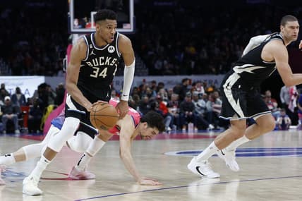 Mar 5, 2023; Washington, District of Columbia, USA; Milwaukee Bucks forward Giannis Antetokounmpo (34) drives to the basket past Washington Wizards forward Deni Avdija (9) at Capital One Arena. Mandatory Credit: Geoff Burke-USA TODAY Sports