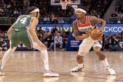 Mar 7, 2023; Detroit, Michigan, USA; Detroit Pistons guard R.J. Hampton (14) defends against Washington Wizards guard Bradley Beal (3) in the first quarter at Little Caesars Arena. Mandatory Credit: David Reginek-USA TODAY Sports