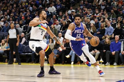 Mar 7, 2023; Minneapolis, Minnesota, USA; Philadelphia 76ers forward Tobias Harris (12) drives while Minnesota Timberwolves forward Kyle Anderson (5) defends during the second quarter at Target Center. Mandatory Credit: Matt Krohn-USA TODAY Sports
