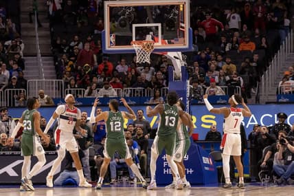 Mar 7, 2023; Detroit, Michigan, USA; Washington Wizards center Daniel Gafford (21) shoots the game winning basket as time runs out against the Detroit Pistons in the fourth quarter at Little Caesars Arena. Mandatory Credit: David Reginek-USA TODAY Sports