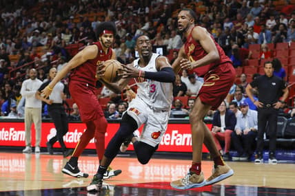 Mar 8, 2023; Miami, Florida, USA; Miami Heat center Bam Adebayo (13) drives to the basket ahead of Cleveland Cavaliers center Jarrett Allen (31) and forward Evan Mobley (4) during the first quarter at Miami-Dade Arena. Mandatory Credit: Sam Navarro-USA TODAY Sports