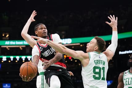 Mar 8, 2023; Boston, Massachusetts, USA; Portland Trail Blazers Cam Reddish (5)  shoots against Boston Celtics forward Blake Griffin (91) in the first quarter at TD Garden. Mandatory Credit: David Butler II-USA TODAY Sports