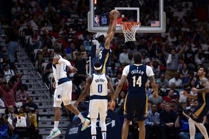 Mar 8, 2023; New Orleans, Louisiana, USA;  New Orleans Pelicans guard Trey Murphy III (25) dunks the ball against Dallas Mavericks forward Markieff Morris (13) during the first half at Smoothie King Center. Mandatory Credit: Stephen Lew-USA TODAY Sports