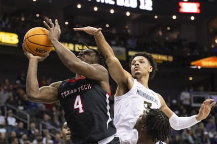 Mar 8, 2023; Kansas City, MO, USA; Texas Tech Red Raiders forward Robert Jennings (4) shoots the ball while defended by West Virginia Mountaineers forward Tre Mitchell (3) in the first half at T-Mobile Center. Mandatory Credit: Amy Kontras-USA TODAY Sports