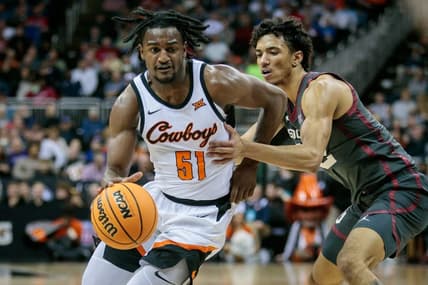 Mar 8, 2023; Kansas City, MO, USA; Oklahoma State Cowboys guard John-Michael Wright (51) drives to the basket during the first half against the Oklahoma Sooners at T-Mobile Center. Mandatory Credit: William Purnell-USA TODAY Sports