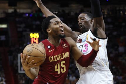 Mar 8, 2023; Miami, Florida, USA; Cleveland Cavaliers guard Donovan Mitchell (45) drives to the basket against Miami Heat center Bam Adebayo (13) during the third quarter  at Miami-Dade Arena. Mandatory Credit: Sam Navarro-USA TODAY Sports