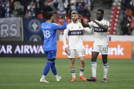 Mar 8, 2023; Vancouver, British Columbia, CAN;  Vancouver Whitecaps FC goalkeeper Yohei Takaoka (18) celebrates the win with defender Tristan Blackmon (6) and defender Karifa Yao (12) during the second half at BC Place Stadium. Mandatory Credit: Anne-Marie Sorvin-USA TODAY Sports