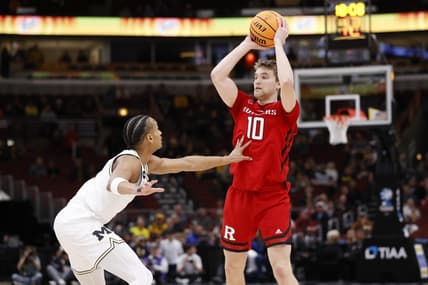 Mar 9, 2023; Chicago, IL, USA; Rutgers Scarlet Knights guard Cam Spencer (10) looks to pass the ball against Michigan Wolverines guard Kobe Bufkin (2) during the first half at United Center. Mandatory Credit: Kamil Krzaczynski-USA TODAY Sports