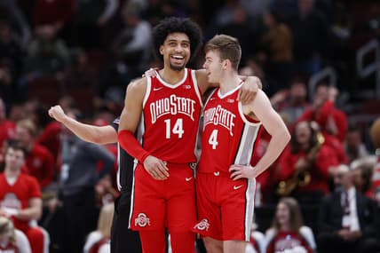 Mar 10, 2023; Chicago, IL, USA; Ohio State Buckeyes forward Justice Sueing (14) and guard Sean McNeil (4) celebrate teams win against the Michigan State Spartans at United Center. Mandatory Credit: Kamil Krzaczynski-USA TODAY Sports