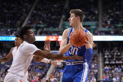 Mar 10, 2023; Greensboro, NC, USA;  Duke Blue Devils center Kyle Filipowski (30) with the ball as Clemson Tigers guard Chase Hunter (1) defends in the first half during the semifinals of the ACC Tournament at Greensboro Coliseum. Mandatory Credit: Bob Donnan-USA TODAY Sports
