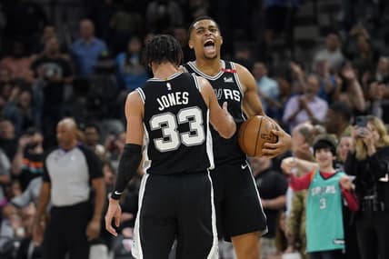 Mar 10, 2023; San Antonio, Texas, USA; San Antonio Spurs forward Keldon Johnson (3) and guard Tre Jones (33) react after a victory over the Denver Nuggets at AT&T Center. Mandatory Credit: Scott Wachter-USA TODAY Sports