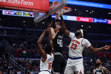 Mar 11, 2023; Los Angeles, California, USA;  Los Angeles Clippers center Ivica Zubac (40) fights for a rebound against New York Knicks center Mitchell Robinson (23) during the second quarter at Crypto.com Arena. Mandatory Credit: Kiyoshi Mio-USA TODAY Sports