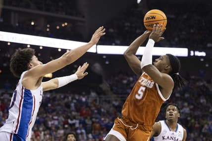 Mar 11, 2023; Kansas City, MO, USA; Texas Longhorns guard Marcus Carr (5) shoots the ball against Kansas Jayhawks forward Jalen Wilson (10) in the first half at T-Mobile Center. Mandatory Credit: Amy Kontras-USA TODAY Sports
