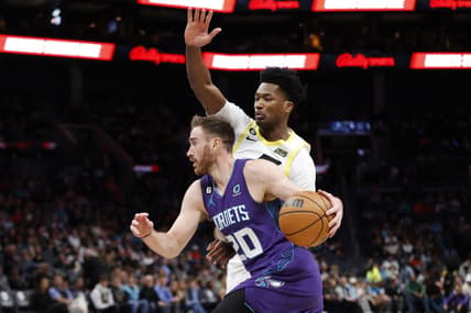 Mar 11, 2023; Charlotte, North Carolina, USA; Charlotte Hornets forward Gordon Hayward (20) drives past Utah Jazz center Damian Jones (15) during the first quarter at Spectrum Center. Mandatory Credit: Brian Westerholt-USA TODAY Sports