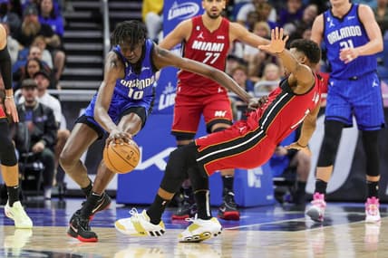 Mar 11, 2023; Orlando, Florida, USA; Orlando Magic center Bol Bol (10) handles the ball against Miami Heat guard Kyle Lowry (7) during the second quarter at Amway Center. Mandatory Credit: Mike Watters-USA TODAY Sports