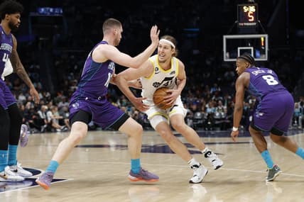 Mar 11, 2023; Charlotte, North Carolina, USA; Utah Jazz forward Kelly Olynyk (41) tries to drive past Charlotte Hornets guard Svi Mykhailiuk (10) during the second half at Spectrum Center. Mandatory Credit: Brian Westerholt-USA TODAY Sports