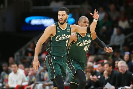Mar 11, 2023; Atlanta, Georgia, USA; Boston Celtics forward Jayson Tatum (0) reacts after a three-pointer as center Al Horford (42) looks on against the Atlanta Hawks in the second half at State Farm Arena. Mandatory Credit: Brett Davis-USA TODAY Sports