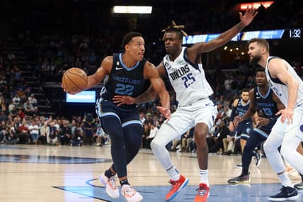 Mar 11, 2023; Memphis, Tennessee, USA; Memphis Grizzlies guard Desmond Bane (22) drives to the basket as Dallas Mavericks forward Reggie Bullock (25) defends during the second half at FedExForum. Mandatory Credit: Petre Thomas-USA TODAY Sports
