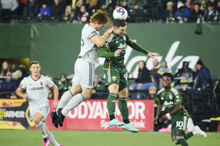 Mar 11, 2023; Portland, Oregon, USA;  Portland Timbers forward Nathan Fogaca (99) heads the ball during the first half against St. Louis City defender Tim Parker (26) at Providence Park. Mandatory Credit: Troy Wayrynen-USA TODAY Sports