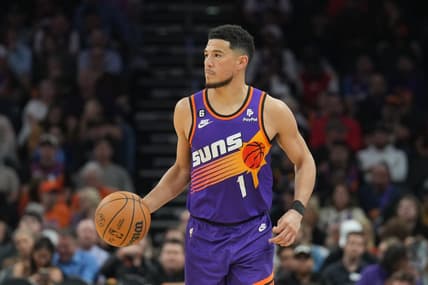 Mar 11, 2023; Phoenix, Arizona, USA; Phoenix Suns guard Devin Booker (1) dribbles against the Sacramento Kings during the second half at Footprint Center. Mandatory Credit: Joe Camporeale-USA TODAY Sports