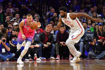 Mar 12, 2023; Philadelphia, Pennsylvania, USA; Washington Wizards center Kristaps Porzingis (6) and Philadelphia 76ers center Joel Embiid (21) chase after loose ball during the first quarter at Wells Fargo Center. Mandatory Credit: Eric Hartline-USA TODAY Sports