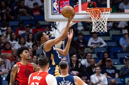 Mar 12, 2023; New Orleans, Louisiana, USA; New Orleans Pelicans guard Trey Murphy III (25) drives to the basket against Portland Trail Blazers center Jusuf Nurkic (27) during the first half at Smoothie King Center. Mandatory Credit: Stephen Lew-USA TODAY Sports
