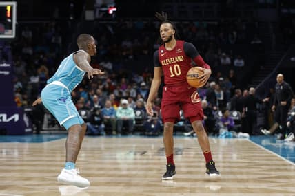 Mar 12, 2023; Charlotte, North Carolina, USA; Cleveland Cavaliers guard Darius Garland (10) is guarded by Charlotte Hornets guard Terry Rozier (3) during the first half at Spectrum Center. Mandatory Credit: Brian Westerholt-USA TODAY Sports
