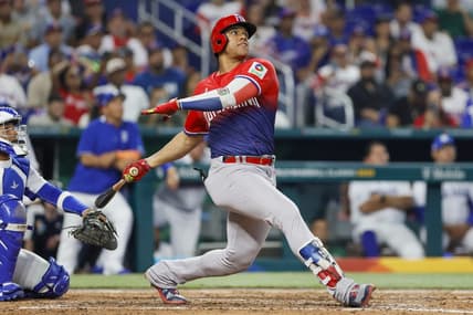 Mar 13, 2023; Miami, Florida, USA; Dominican Republic left fielder Juan Soto (22) hits a home run during the sixth inning against Nicaragua at LoanDepot Park. Mandatory Credit: Sam Navarro-USA TODAY Sports