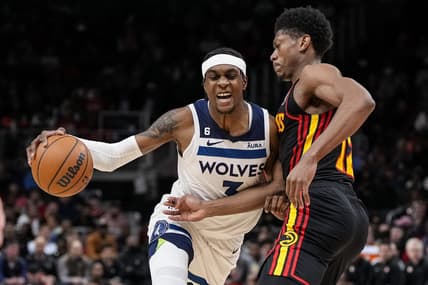 Mar 13, 2023; Atlanta, Georgia, USA; Minnesota Timberwolves guard Jordan McLaughlin (6) dribbles against Atlanta Hawks forward De'Andre Hunter (12) during the first half at State Farm Arena. Mandatory Credit: Dale Zanine-USA TODAY Sports